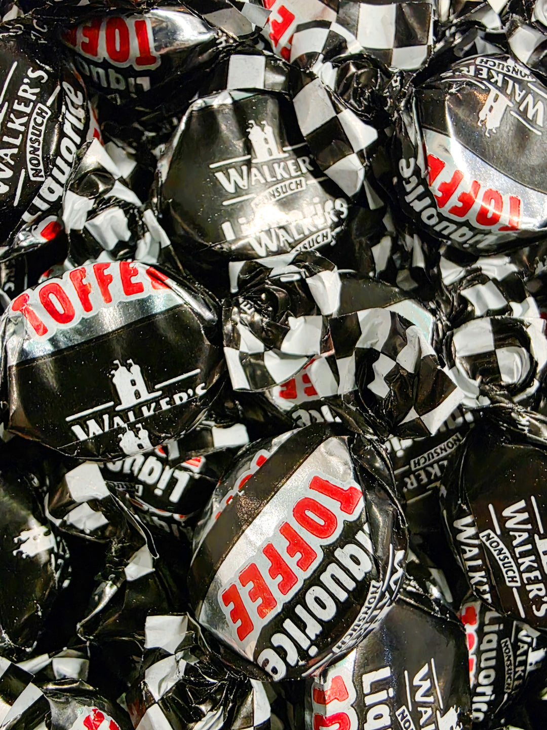 Close-up of Walker's Licorice toffee candies with visible branding.